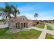 Well-maintained home featuring mature trees and colorful landscaping at 29704 Eagle Station Dr, Wesley Chapel, FL 33543