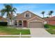 Inviting exterior showcases a neutral color palette and well-maintained landscaping at 29704 Eagle Station Dr, Wesley Chapel, FL 33543