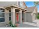 Covered front porch with stone columns leading to the entryway at 29704 Eagle Station Dr, Wesley Chapel, FL 33543