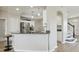 Bright kitchen features granite countertops, stainless steel appliances, and stylish pendant lighting at 29704 Eagle Station Dr, Wesley Chapel, FL 33543