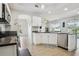 Open-concept kitchen with granite counters, stainless appliances, and seamless flow to living area at 29704 Eagle Station Dr, Wesley Chapel, FL 33543