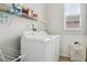 Functional laundry room with a washer, dryer, and ample storage space, creating an organized area at 29704 Eagle Station Dr, Wesley Chapel, FL 33543