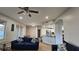 Inviting living room featuring wood floors, neutral paint and a kitchen view with seating area at 29704 Eagle Station Dr, Wesley Chapel, FL 33543