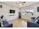 Cozy living room bathed in natural light with hardwood floors at 29704 Eagle Station Dr, Wesley Chapel, FL 33543