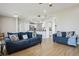 Bright living room with hardwood floors opens to the kitchen area at 29704 Eagle Station Dr, Wesley Chapel, FL 33543
