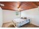 This bedroom has carpet, a window, and a bed with a decorative quilt at 4100 46Th N Ave, St Petersburg, FL 33714