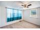 Bright bedroom with neutral carpet, sheer curtains and a window at 4100 46Th N Ave, St Petersburg, FL 33714