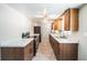 Modern kitchen featuring new white countertop, stainless steel appliances, and light and dark cabinets at 4100 46Th N Ave, St Petersburg, FL 33714