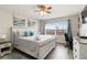 Bedroom with large window offering lots of light, a queen sized bed and a small writing desk at 6131 Bahia Del Mar Blvd # 139, St Petersburg, FL 33715