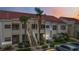 Multi-unit building with red tile roof, palm trees, and parking area, providing convenient access to homes at 6131 Bahia Del Mar Blvd # 139, St Petersburg, FL 33715