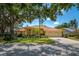 Beautiful single-story home with a well-maintained yard and mature trees offering shade at 8202 Shadow Pine Way, Sarasota, FL 34238