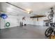 Large two car garage with storage, overhead lighting, and room for working on projects at 8202 Shadow Pine Way, Sarasota, FL 34238