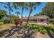 A lovely screened-in pool with lush tropical landscaping, offering a private backyard oasis at 8202 Shadow Pine Way, Sarasota, FL 34238