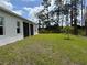 Spacious backyard with lush green grass, privacy, and natural light at 6179 Notre Dame Ter, North Port, FL 34291