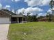 Beautiful single-Gathering home with a well-maintained front yard and brick driveway at 6179 Notre Dame Ter, North Port, FL 34291
