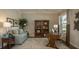 Cozy home office with hardwood floors, built-in bookcase, comfortable seating, and ample natural light at 6179 Notre Dame Ter, North Port, FL 34291