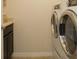 Convenient laundry room featuring modern washer and dryer units at 6179 Notre Dame Ter, North Port, FL 34291