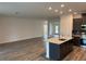 Open-concept living room and kitchen featuring modern finishes and an inviting atmosphere at 6179 Notre Dame Ter, North Port, FL 34291