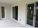 Covered outdoor patio with sliding glass doors offering seamless indoor-outdoor living at 6179 Notre Dame Ter, North Port, FL 34291