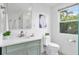 Bright bathroom featuring a white vanity, updated fixtures, and a glass-enclosed shower at 24145 Blackbeard Blvd, Punta Gorda, FL 33955