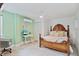 Cozy bedroom with a desk, vintage bed frame and ample natural light for a comfortable living space at 24145 Blackbeard Blvd, Punta Gorda, FL 33955