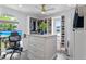 Walk-in closet with a desk and computer setup by the window, and custom shelves and cabinets at 24145 Blackbeard Blvd, Punta Gorda, FL 33955