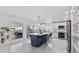 Spacious kitchen with modern appliances, a large island, white cabinets, and a view to the patio at 24145 Blackbeard Blvd, Punta Gorda, FL 33955