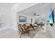 Open-concept living area featuring stylish decor, ample seating, and large windows at 24145 Blackbeard Blvd, Punta Gorda, FL 33955