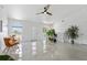 Bright living room with ample natural light, modern furnishings, and a smooth tile floor at 24145 Blackbeard Blvd, Punta Gorda, FL 33955