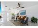 Bright open living area featuring stylish decor, ample seating, and large windows at 24145 Blackbeard Blvd, Punta Gorda, FL 33955