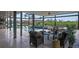 This screened patio features stylish outdoor seating and a luxurious pool with a stone waterfall feature at 24145 Blackbeard Blvd, Punta Gorda, FL 33955