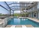Enjoy this expansive pool area with a hot tub, a unique fire feature, and lounge chairs for relaxation at 24145 Blackbeard Blvd, Punta Gorda, FL 33955