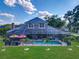 Aerial view of a screened-in pool and patio provides the perfect backyard oasis at 3008 Sutton Woods Dr, Plant City, FL 33566