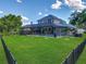 Aerial view of a screened-in pool and patio provides the perfect backyard oasis at 3008 Sutton Woods Dr, Plant City, FL 33566