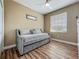 Bedroom featuring a comfortable daybed with a ceiling fan and a window with natural light at 3008 Sutton Woods Dr, Plant City, FL 33566