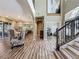 Inviting foyer with hardwood floors, staircase, and an open floor plan at 3008 Sutton Woods Dr, Plant City, FL 33566