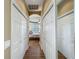 Hallway with closet leading into a bedroom with plenty of natural light at 3008 Sutton Woods Dr, Plant City, FL 33566