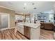 Modern kitchen with island sink, stainless steel appliances, and an open layout for easy entertaining at 3008 Sutton Woods Dr, Plant City, FL 33566