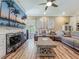 Comfortable living room with contemporary decor and furnishings, featuring a TV and stylish center table at 3008 Sutton Woods Dr, Plant City, FL 33566