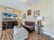 Cozy living room with furniture, entertainment center, and wood-look floors at 3008 Sutton Woods Dr, Plant City, FL 33566