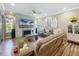 Spacious living room with a stone fireplace accent wall and plenty of seating for guests and Gathering at 3008 Sutton Woods Dr, Plant City, FL 33566