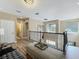 Upstairs loft area with railing, chandelier, and lots of natural light at 3008 Sutton Woods Dr, Plant City, FL 33566