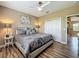Bedroom with a comfortable bed and stylish decor, featuring a ceiling fan and closet at 3008 Sutton Woods Dr, Plant City, FL 33566