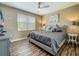 Bedroom featuring a comfortable bed with stylish bedding, complemented by a ceiling fan at 3008 Sutton Woods Dr, Plant City, FL 33566