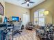 Bright and functional home office features a desk, comfortable seating and lots of light from the window at 3008 Sutton Woods Dr, Plant City, FL 33566