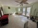 Spacious living room with natural light, french doors, and ceiling fan at 560 7Th S St, Safety Harbor, FL 34695