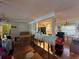 Interior view showcasing an open-concept living space with hardwood floors and kitchen view at 560 7Th S St, Safety Harbor, FL 34695