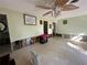 Large living room featuring an open layout, ceiling fan, and light green walls at 560 7Th S St, Safety Harbor, FL 34695