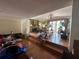 Bright and airy living room featuring hardwood floors, a fireplace, and french doors at 560 7Th S St, Safety Harbor, FL 34695