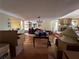 Open living room featuring hard wood floors, fireplace and bright light fixtures at 560 7Th S St, Safety Harbor, FL 34695